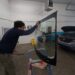 Hank inspecting glass prior to installation